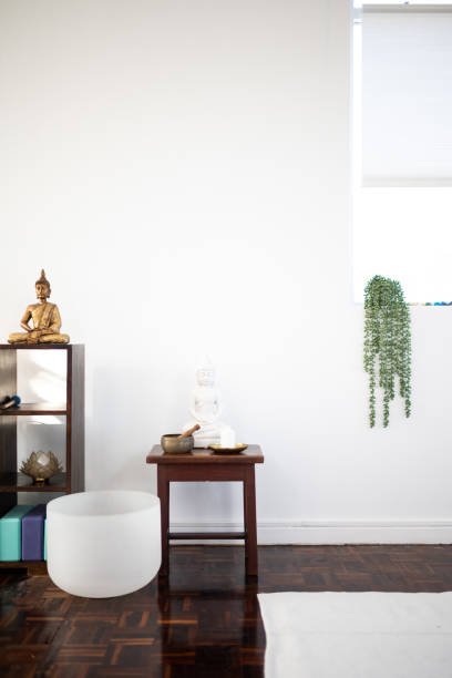yoga studio with singing bowls and buddha statues